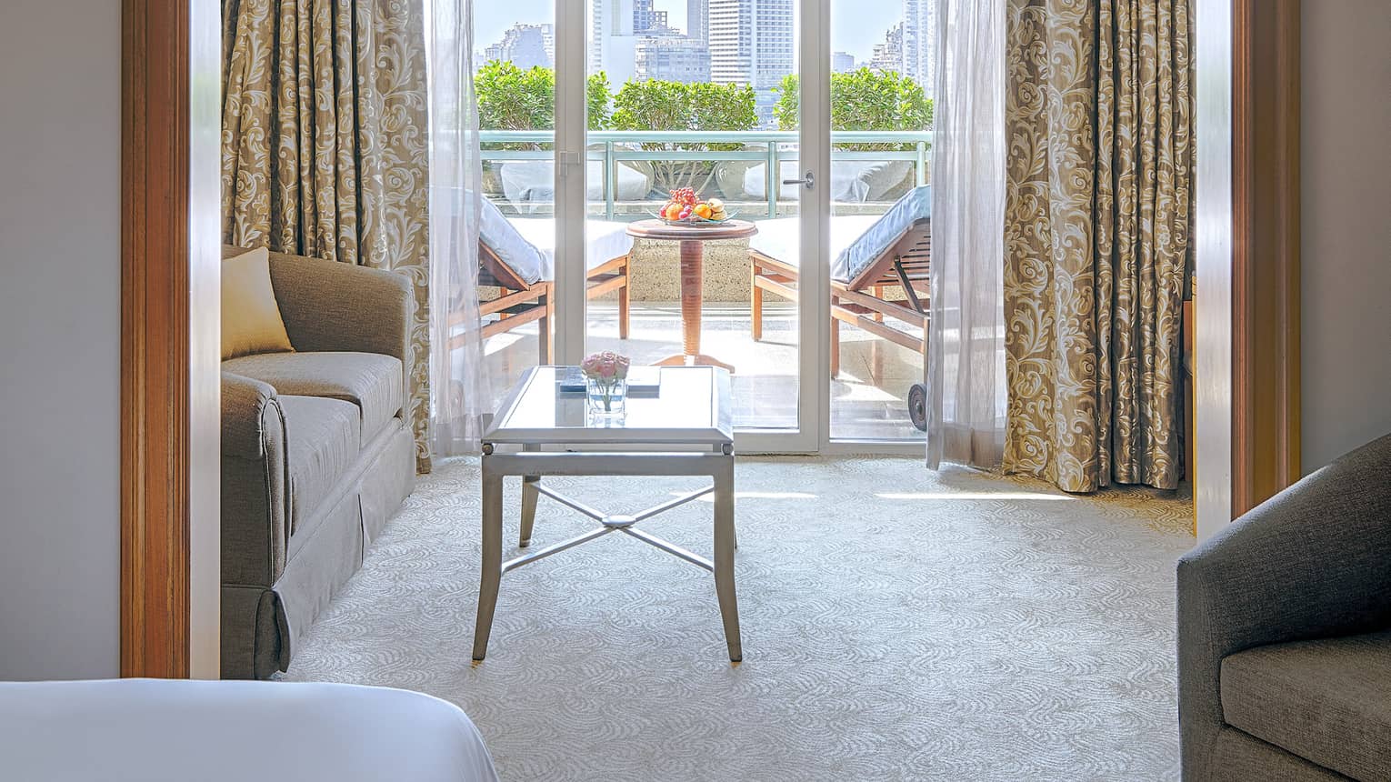 Sitting area off of a bedroom opens to a terrace