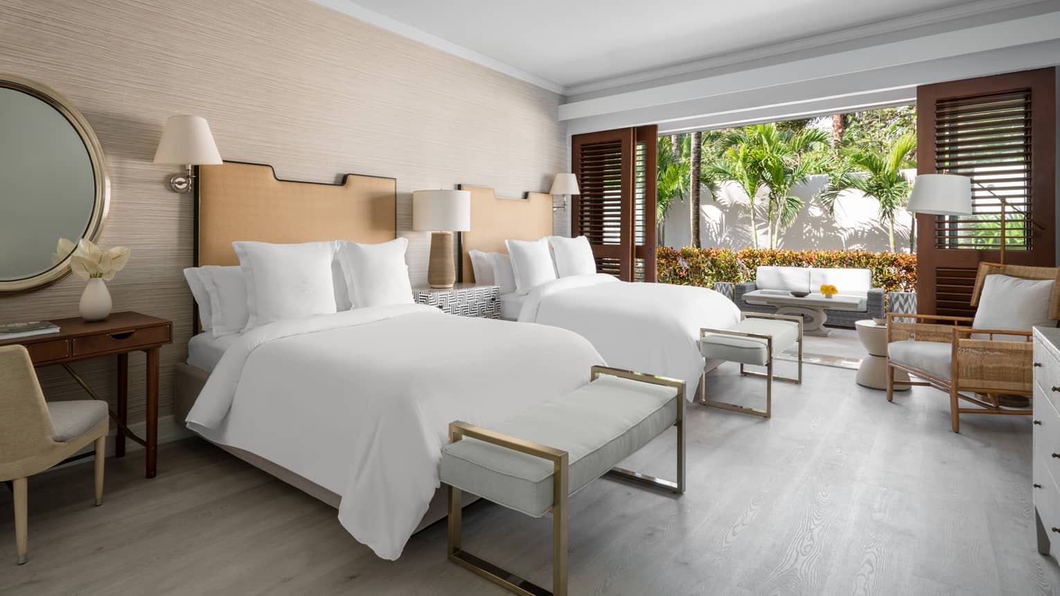 Beachfront Villa Residence bedroom with double beds, open wall to garden patio