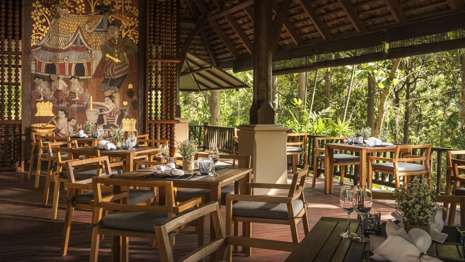 Rim Tai dining tables, chairs in open-air restaurant room