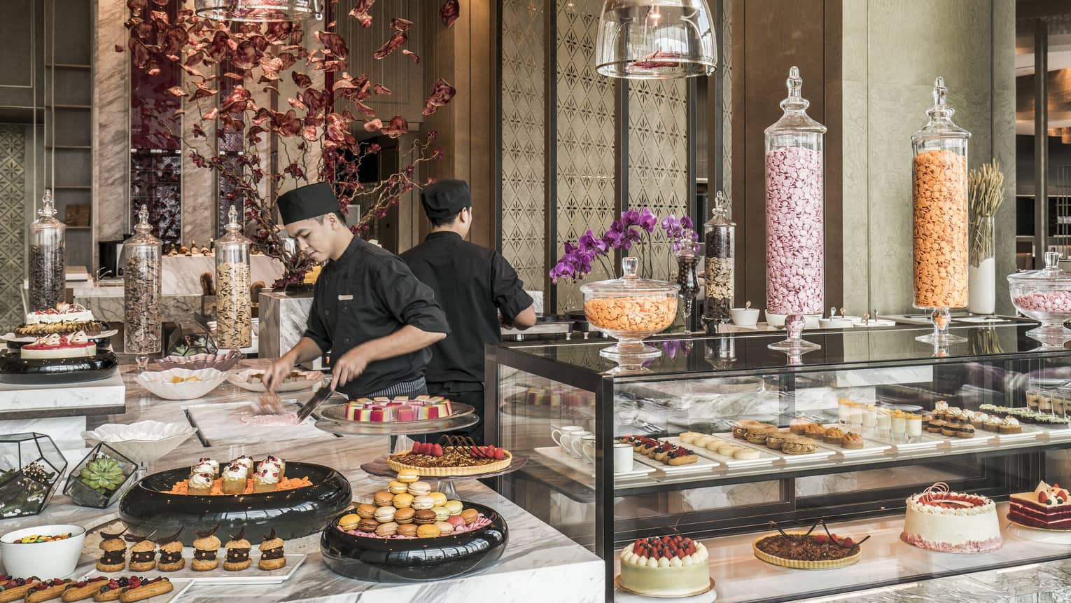 Curate dessert station with two chefs making treats