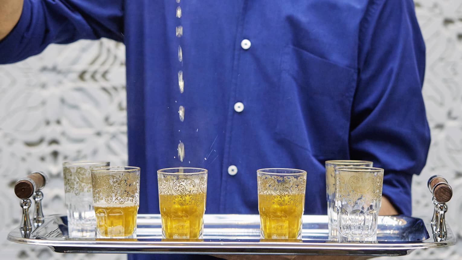 Decorative Moroccan tea glasses on tray