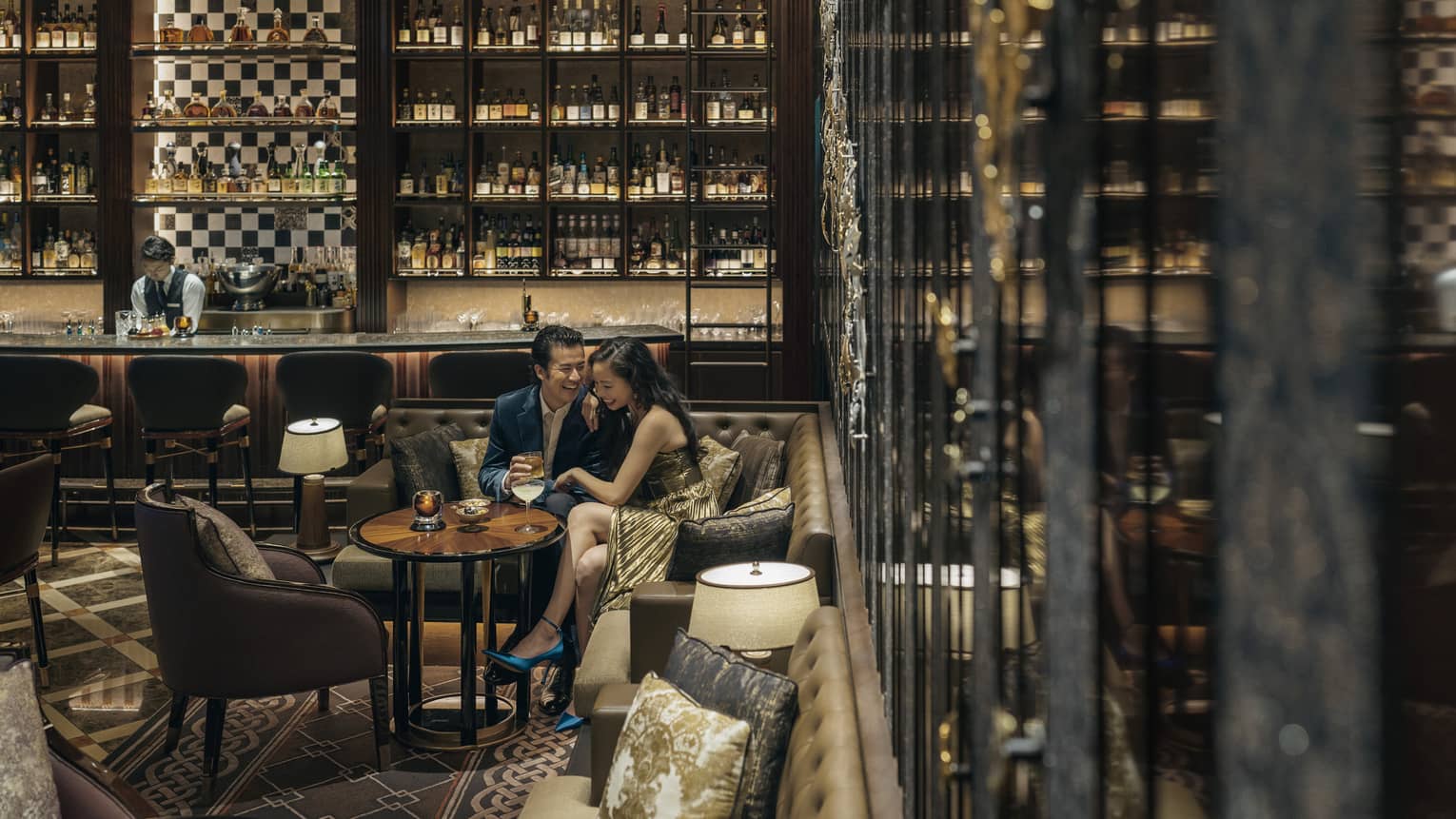 Couple shares cocktails at intimately lit VIRT�