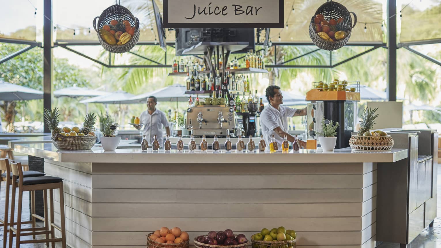 Baskets of fruit adorn the exterior of the wooden paneled juice bar