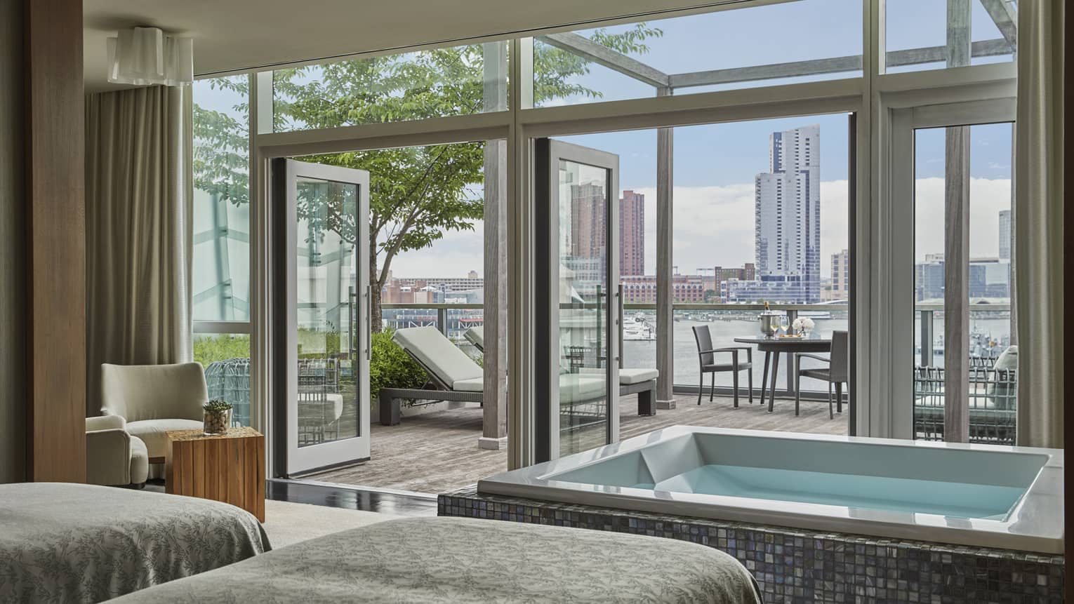 The couple’s VIP Spa suite with a soaking tub and outdoor patio overlooking the harbour