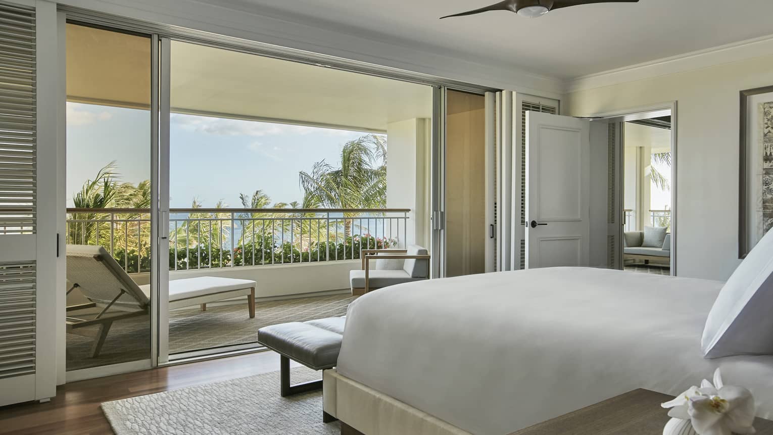 Penthouse Suite bedroom, end of bed, bench by sliding glass balcony doors