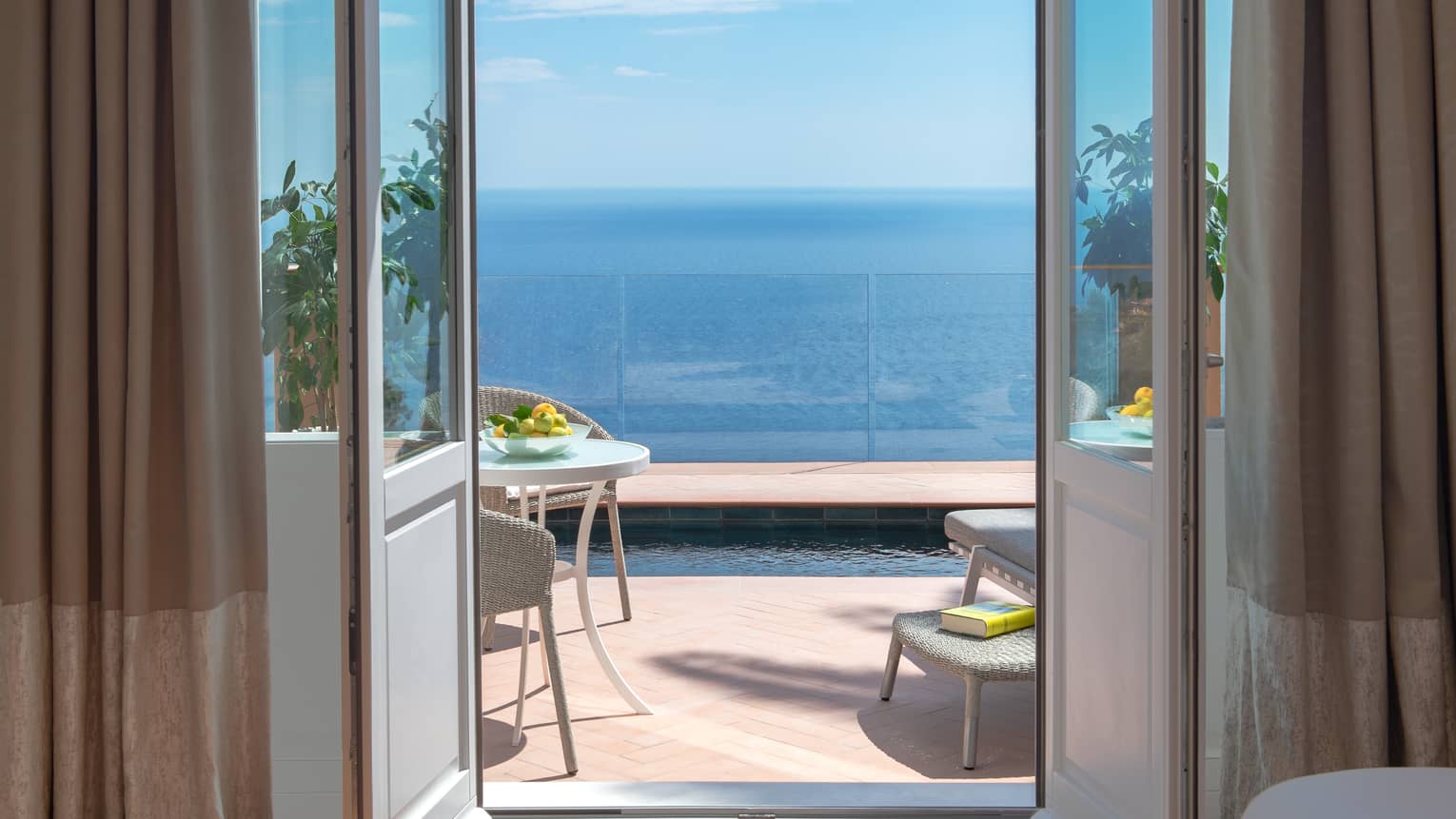 Door leading to private terrace with plunge pool overlooking the sea