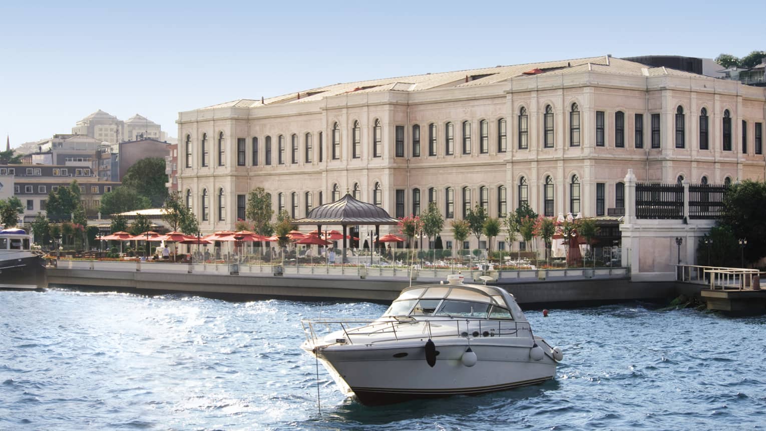 Boat in water in front of Four Seasons Hotel Istanbul at the Bosphorus