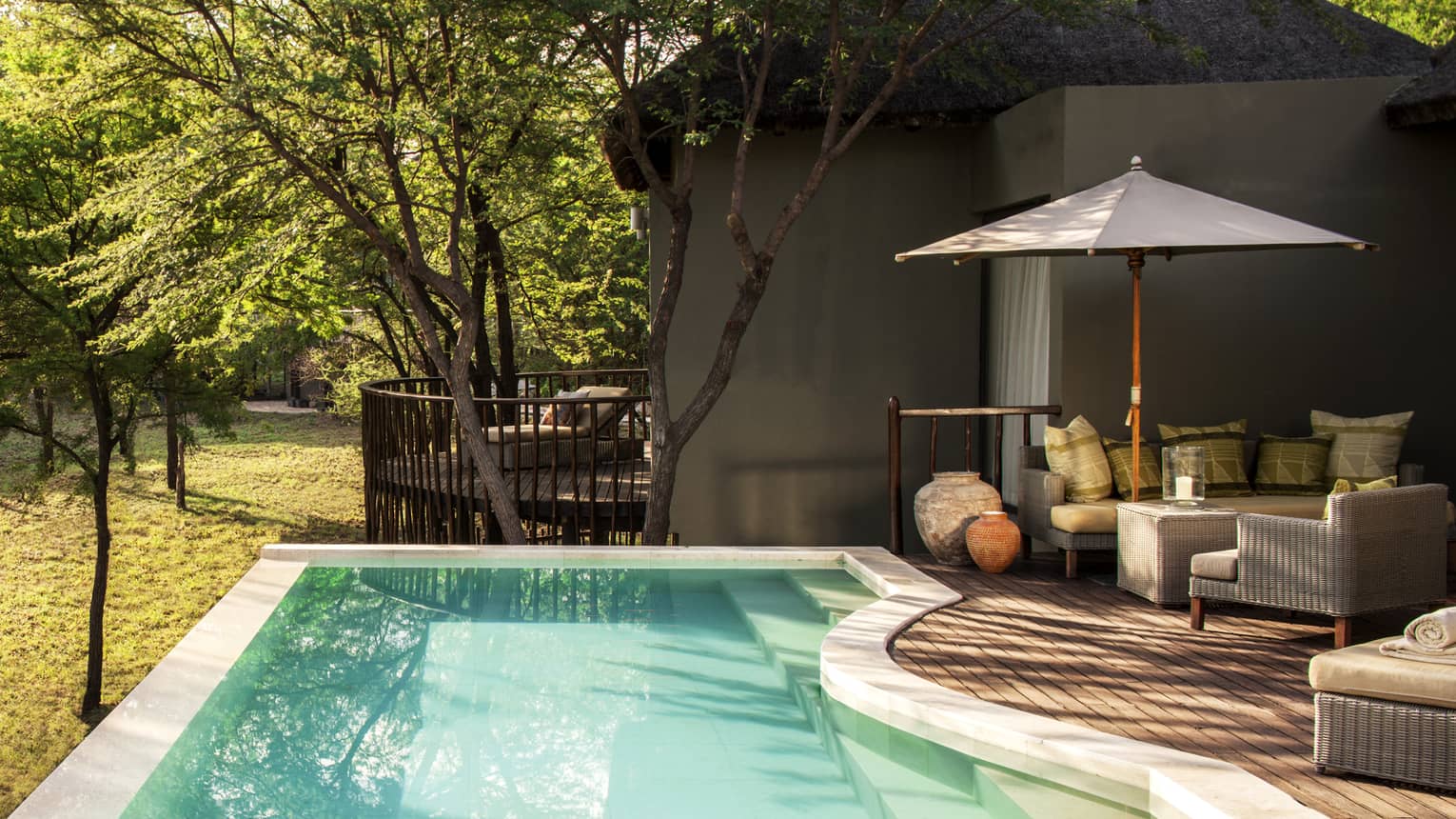 Two-bedroom villa plunge pool, curved patio with umbrella
