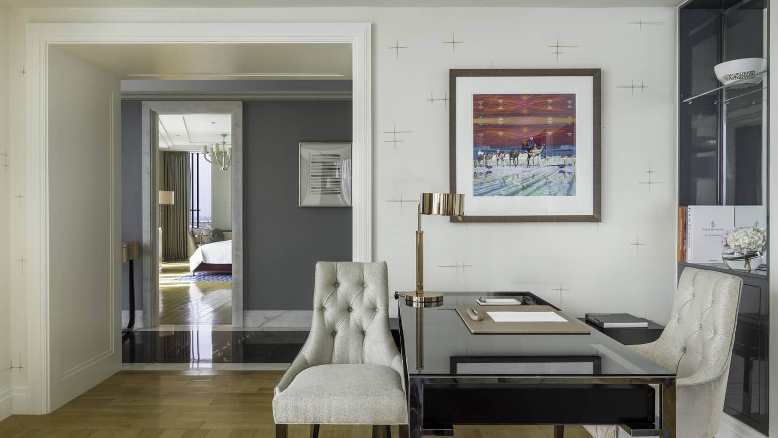 Hotel suite office area, with desk and two upholstered chairs