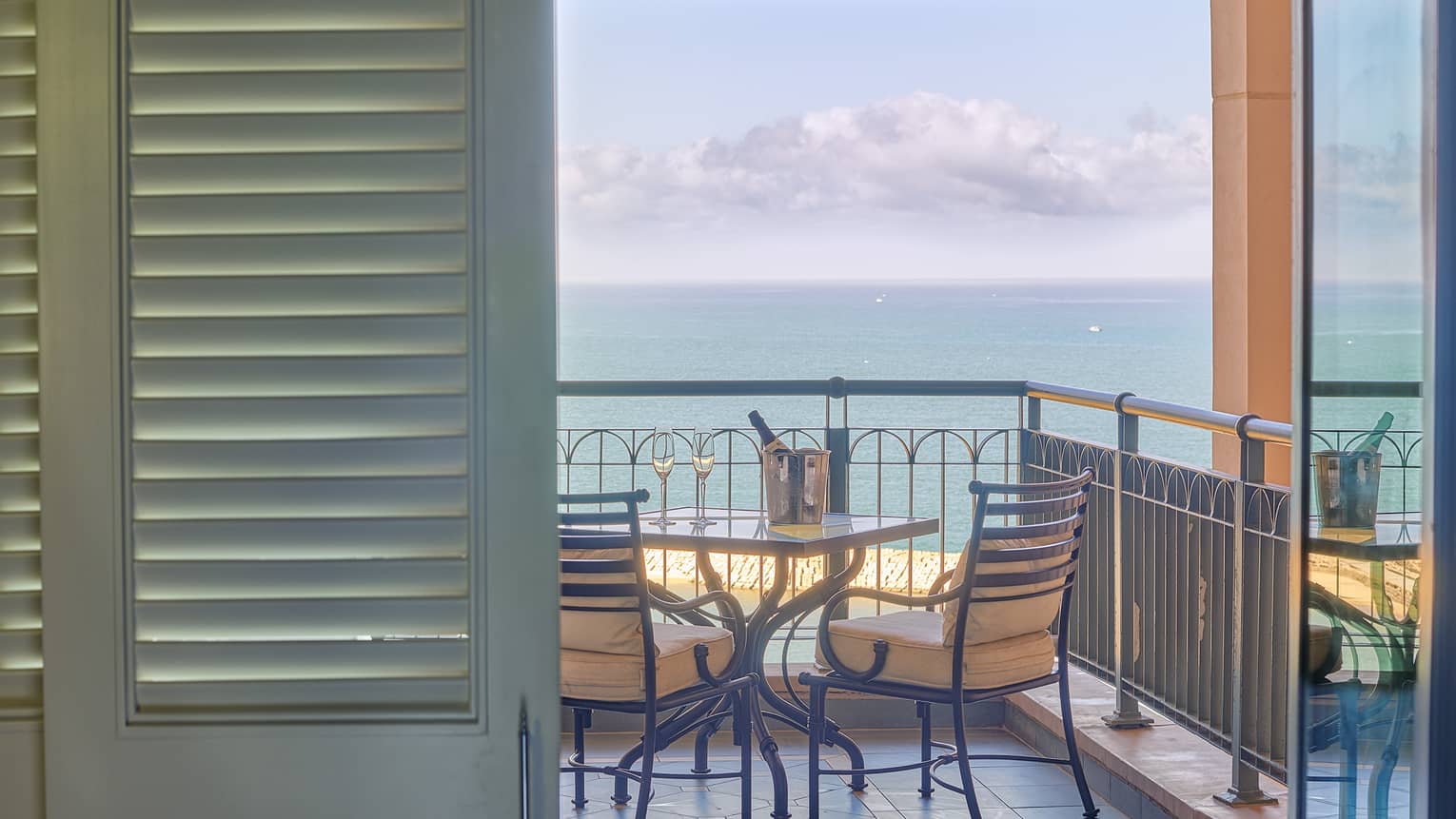 Four Seasons Suite veranda with two-seater table, ocean views