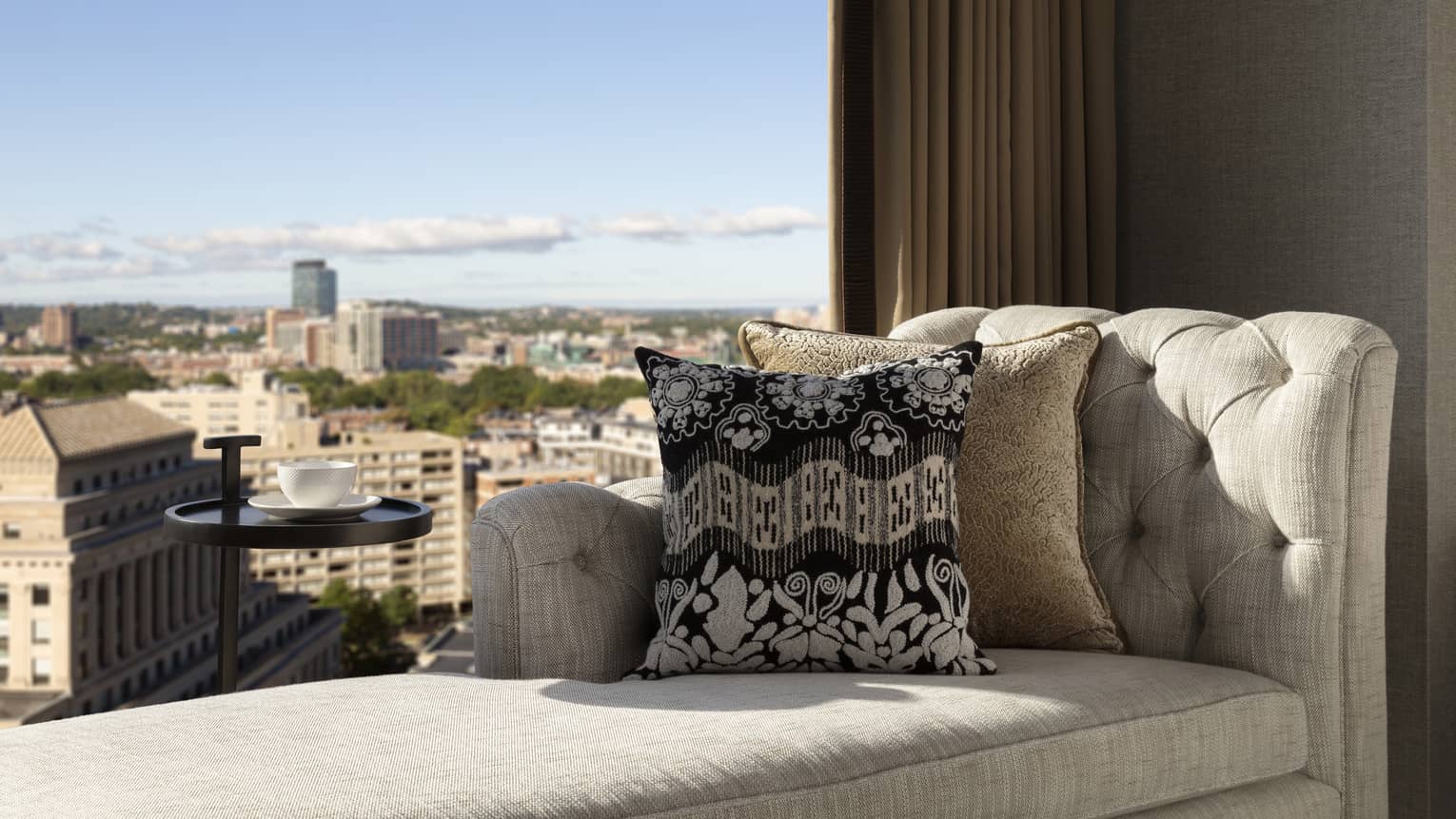 Lounge chair next to the window in a guest room