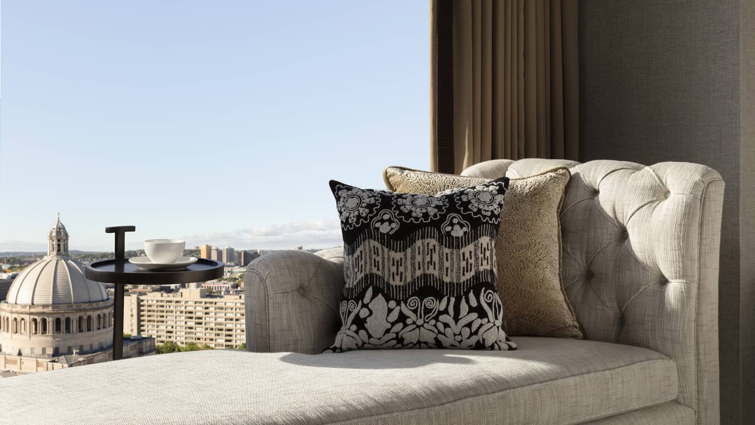 Chaise lounge next to the window in a guest room