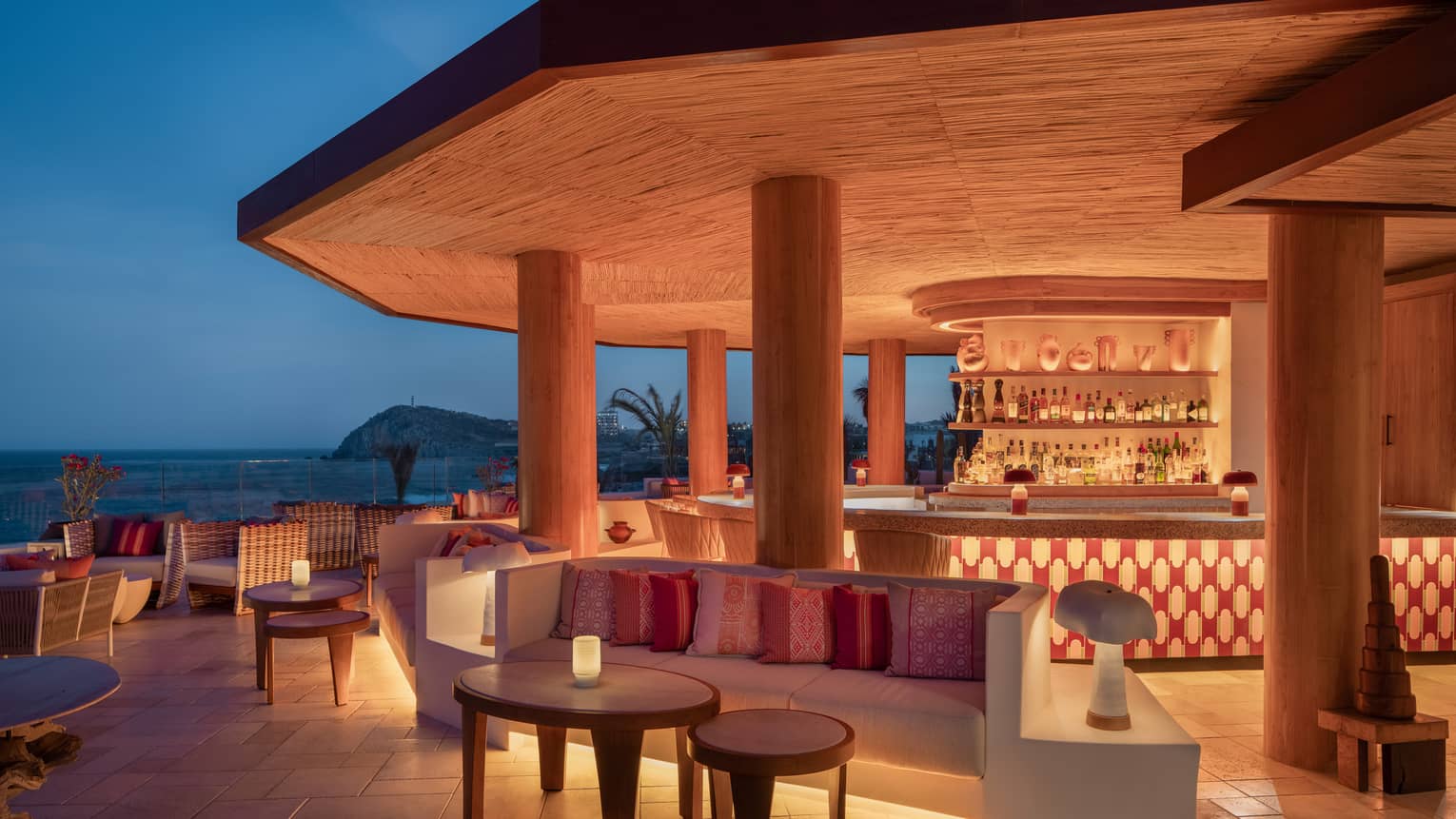 Illuminated ocean view bar at night at Cabo San Lucas