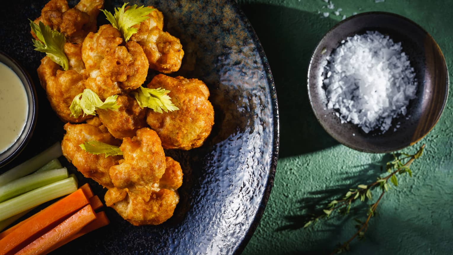 Roasted Cauliflower covered in Buffalo sauce with Celery and Carrots.