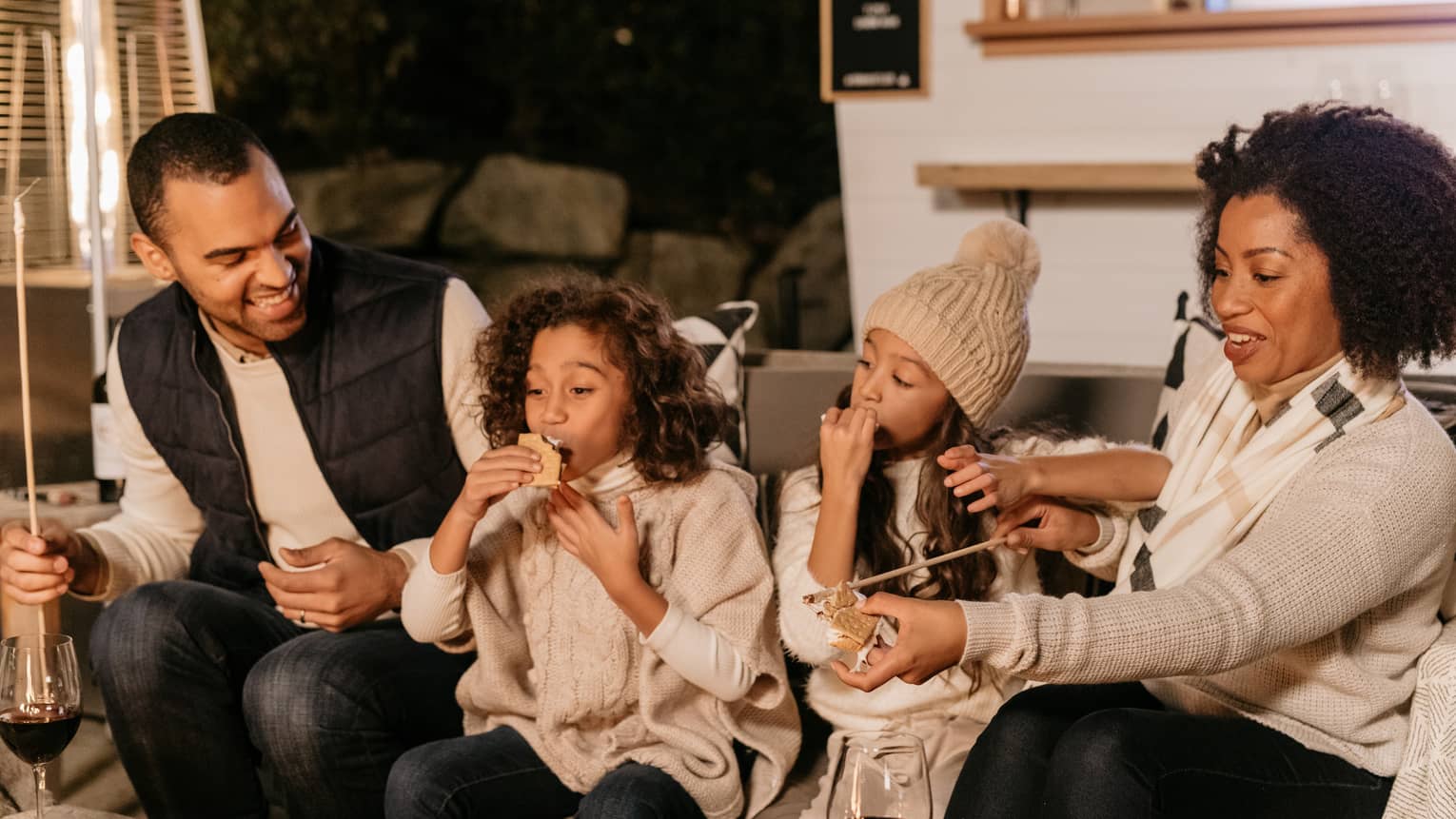 A family enjoying snacks and drinks.