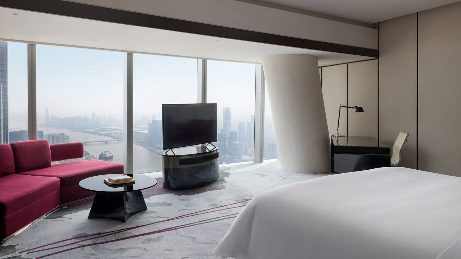 Deluxe King Room River View Room with red accents and floor-to-ceiling windows