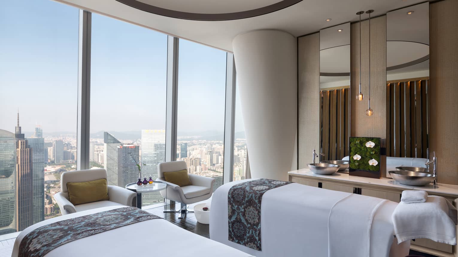 Couples? treatment beds at the Spa with floor-to-ceiling windows and natural light