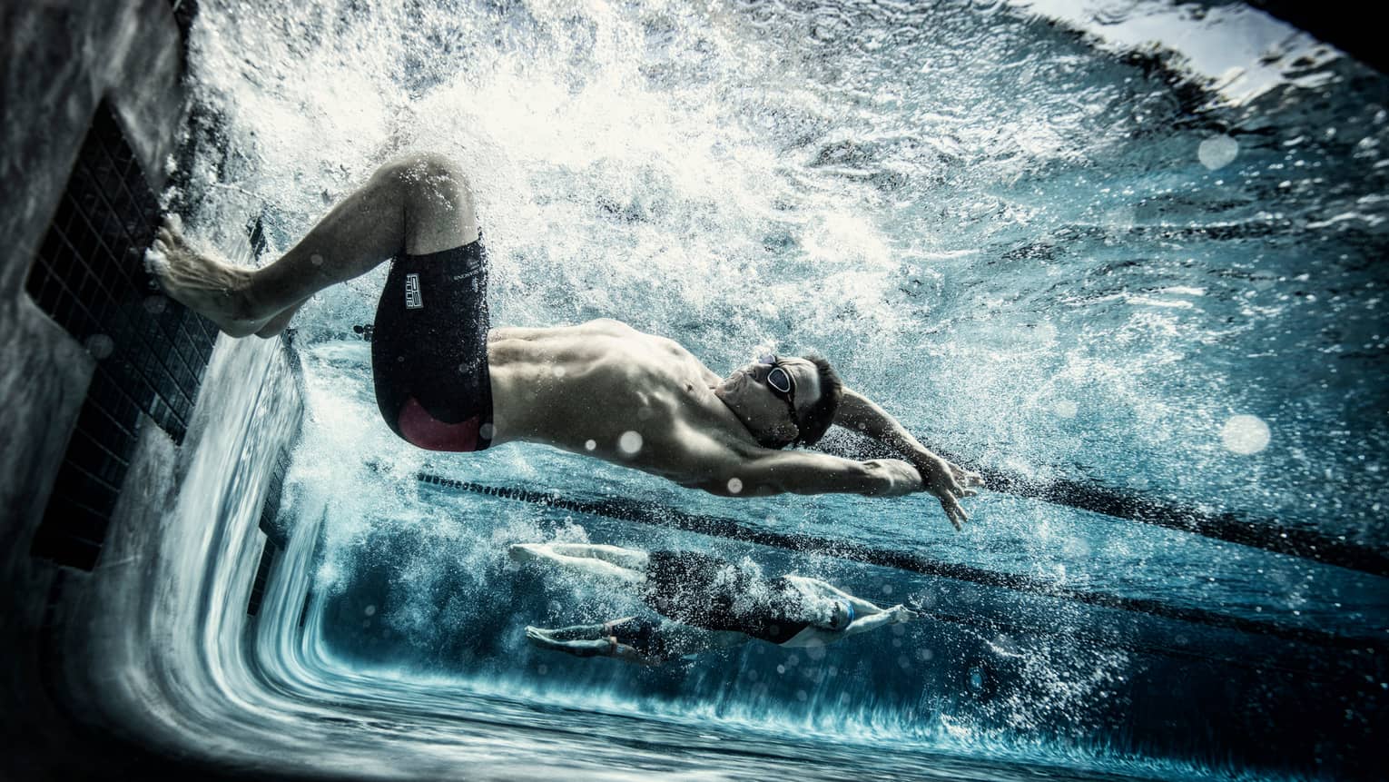 Dave Scott Triathlon camp swimmer practicing underwater in the lap pool