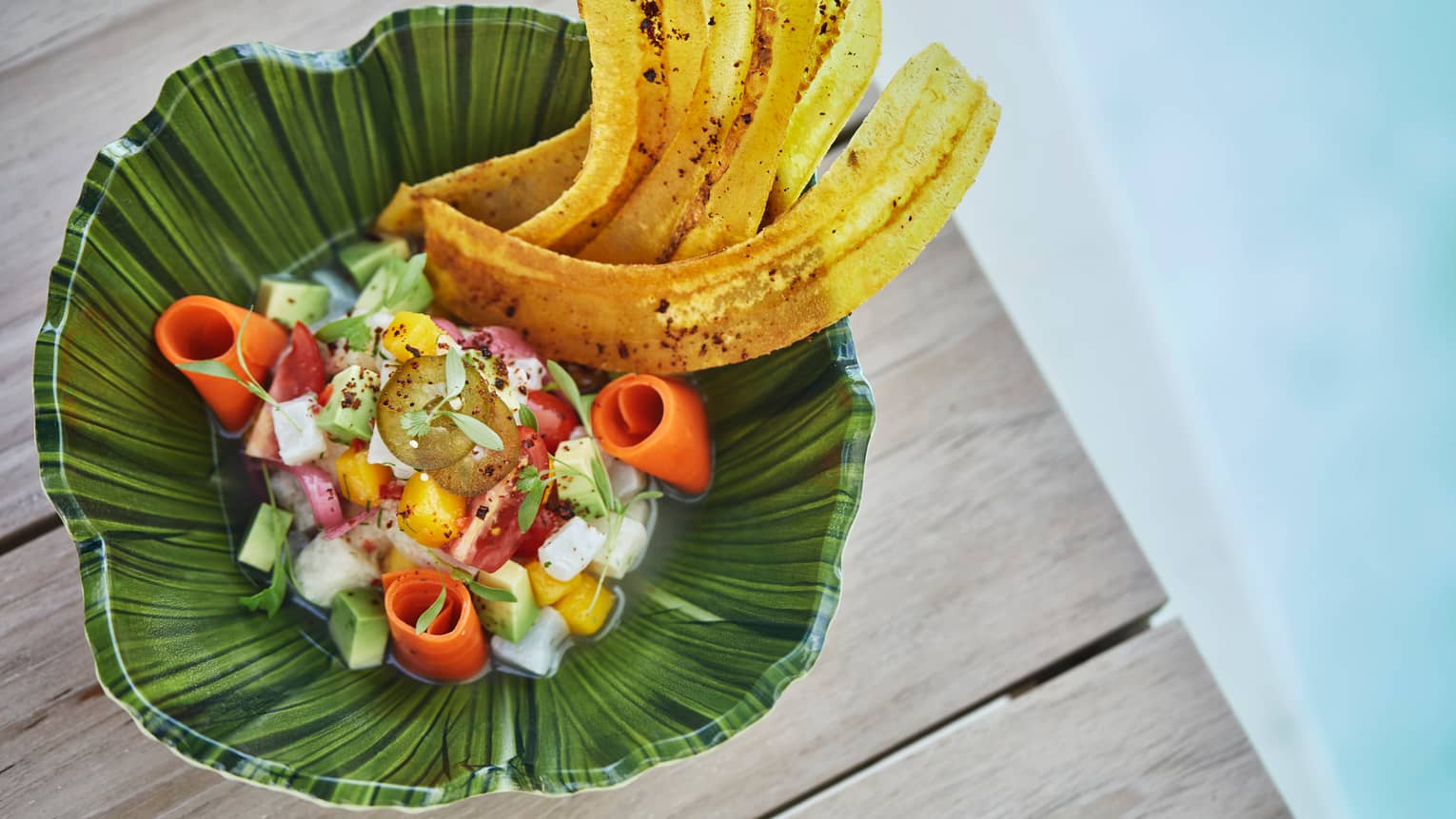 Poolside dining. View of tropical dish snapper ceviche with Florida mango