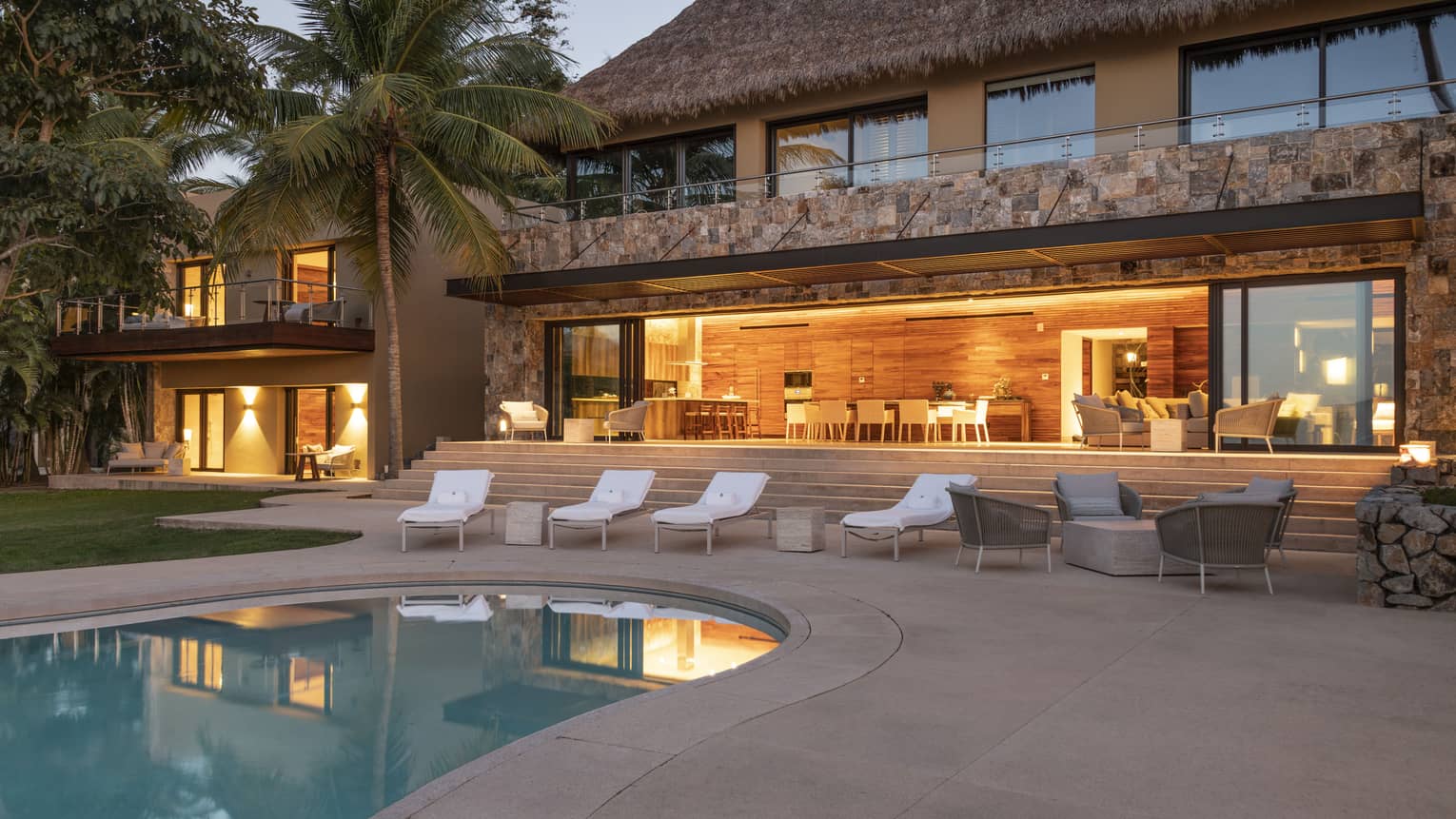 Private residence, Casa Vista, at Four Seasons Resort Tamarindo, illuminated pool deck at night