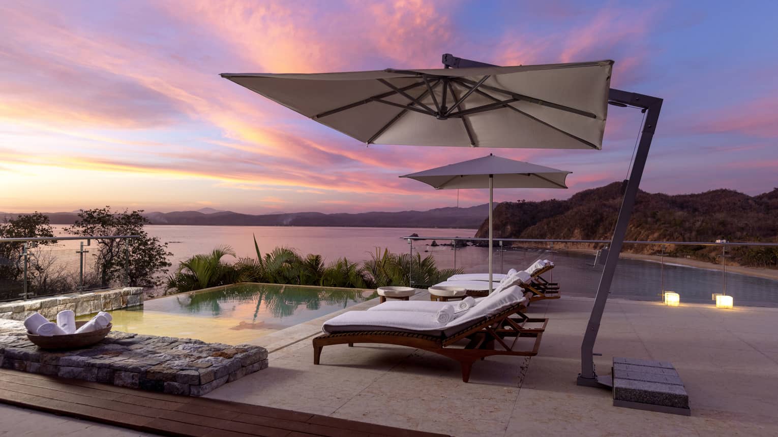 Infinity pool with lounge chairs and view of Tamarindo Beach ? Casa Piedrea residence at Four Seasons Resort Tamarindo, Mexico