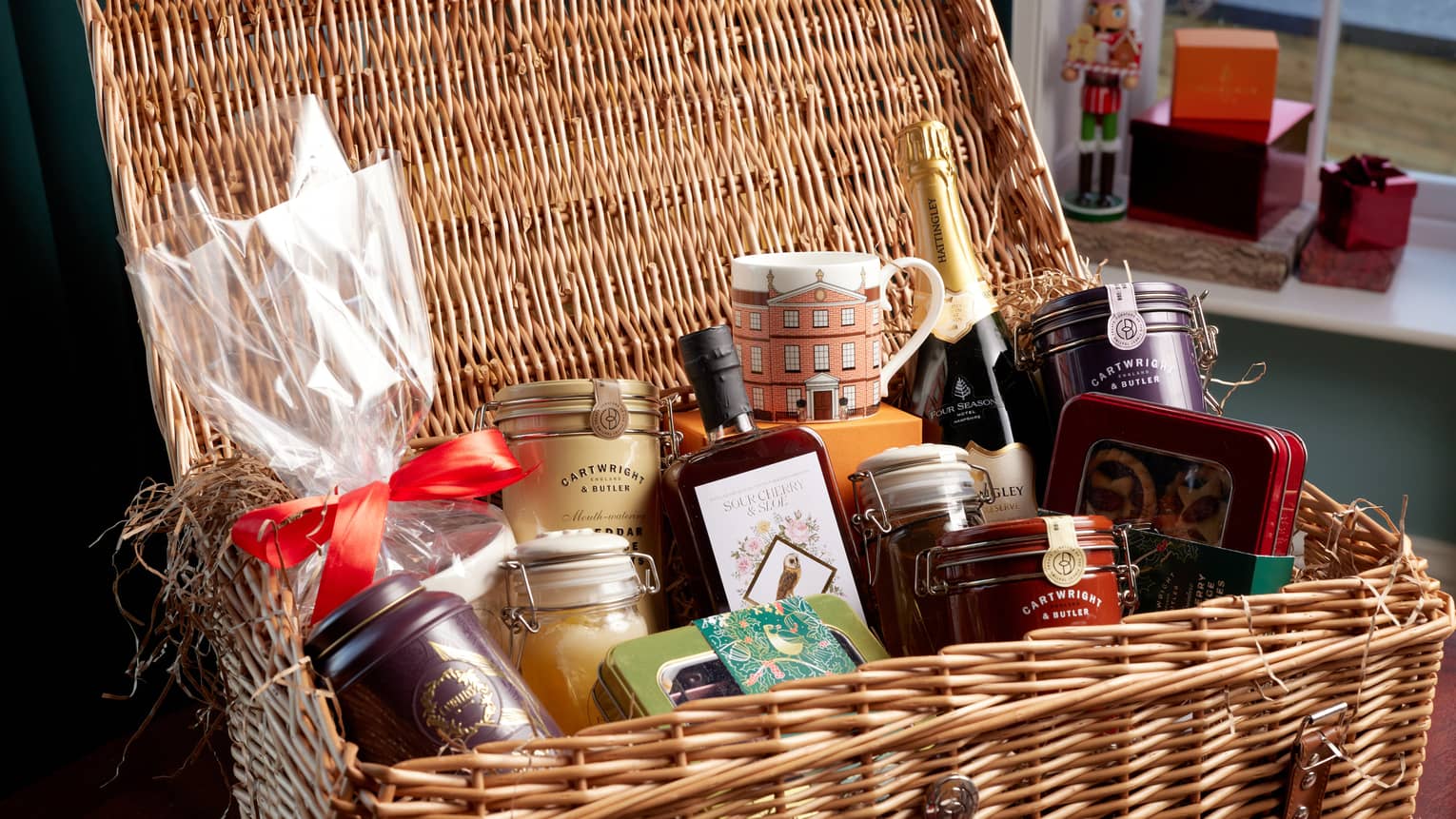 A basket with various festive good and ingredients.