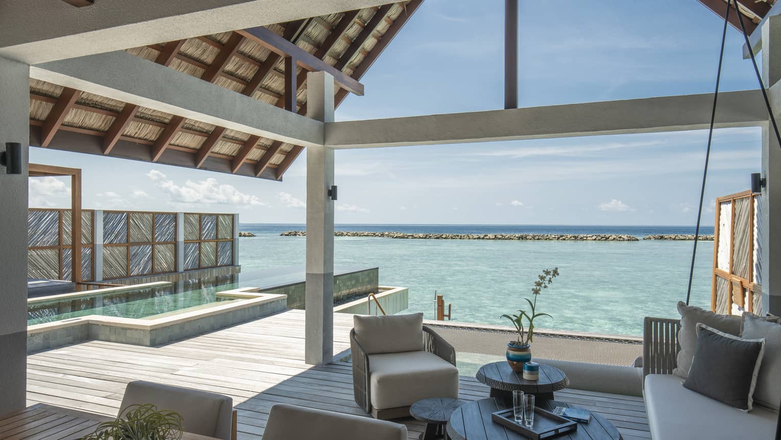Sunrise Water Villa With Pool outdoor covered patio with swing and chair, ocean views, pool