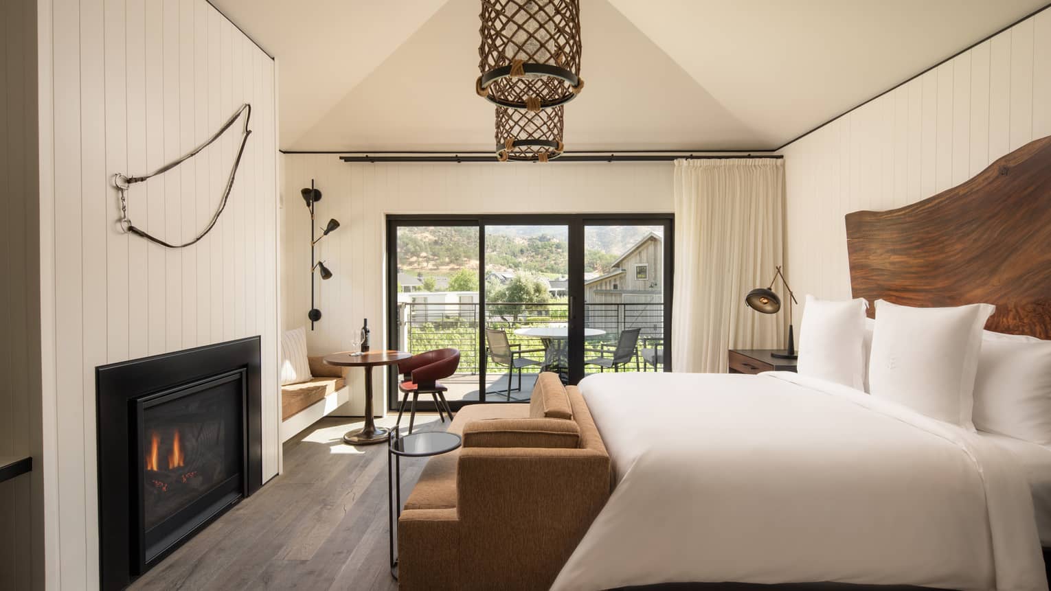 Contemporary king bed guest room at wine country resort