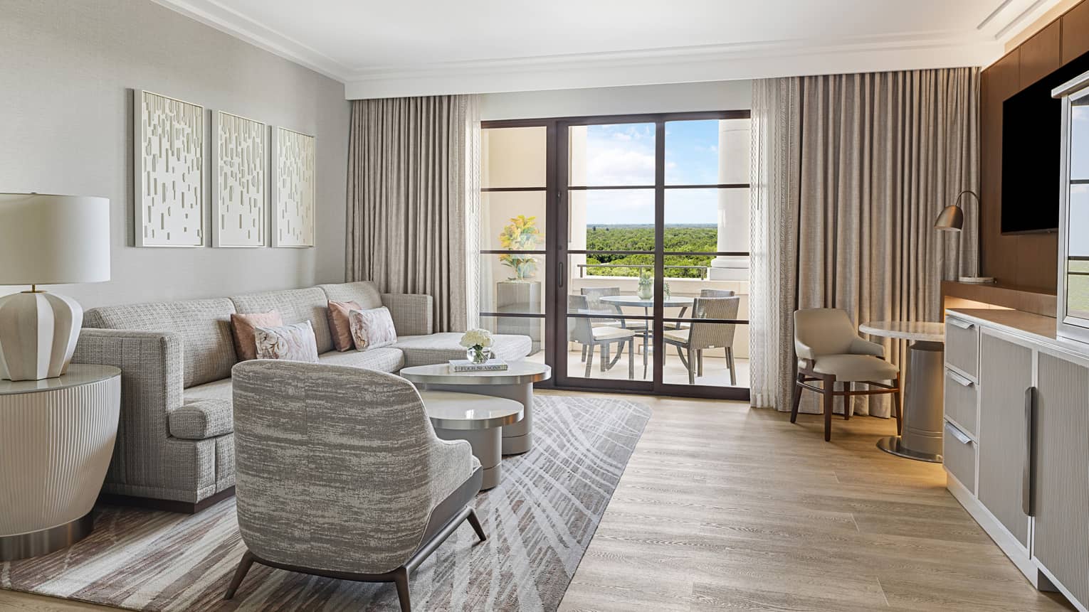 Hotel room living room with walk-out balcony