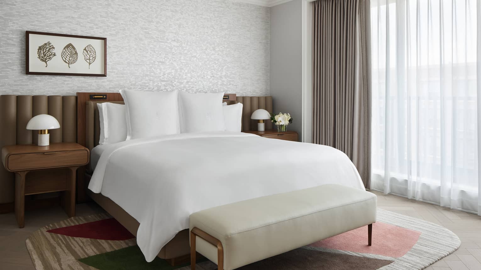 Bedroom with king bed and nature-inspired, contemporary decor at Four Seasons Hotel Washington, DC