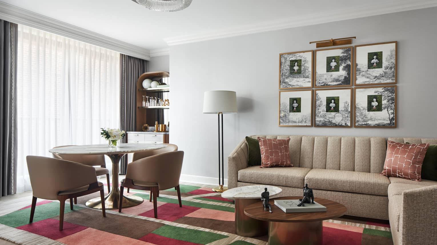 Capital Suite living room with sofa and round dining table with four chairs, at Four Seasons Hotel Washington, DC