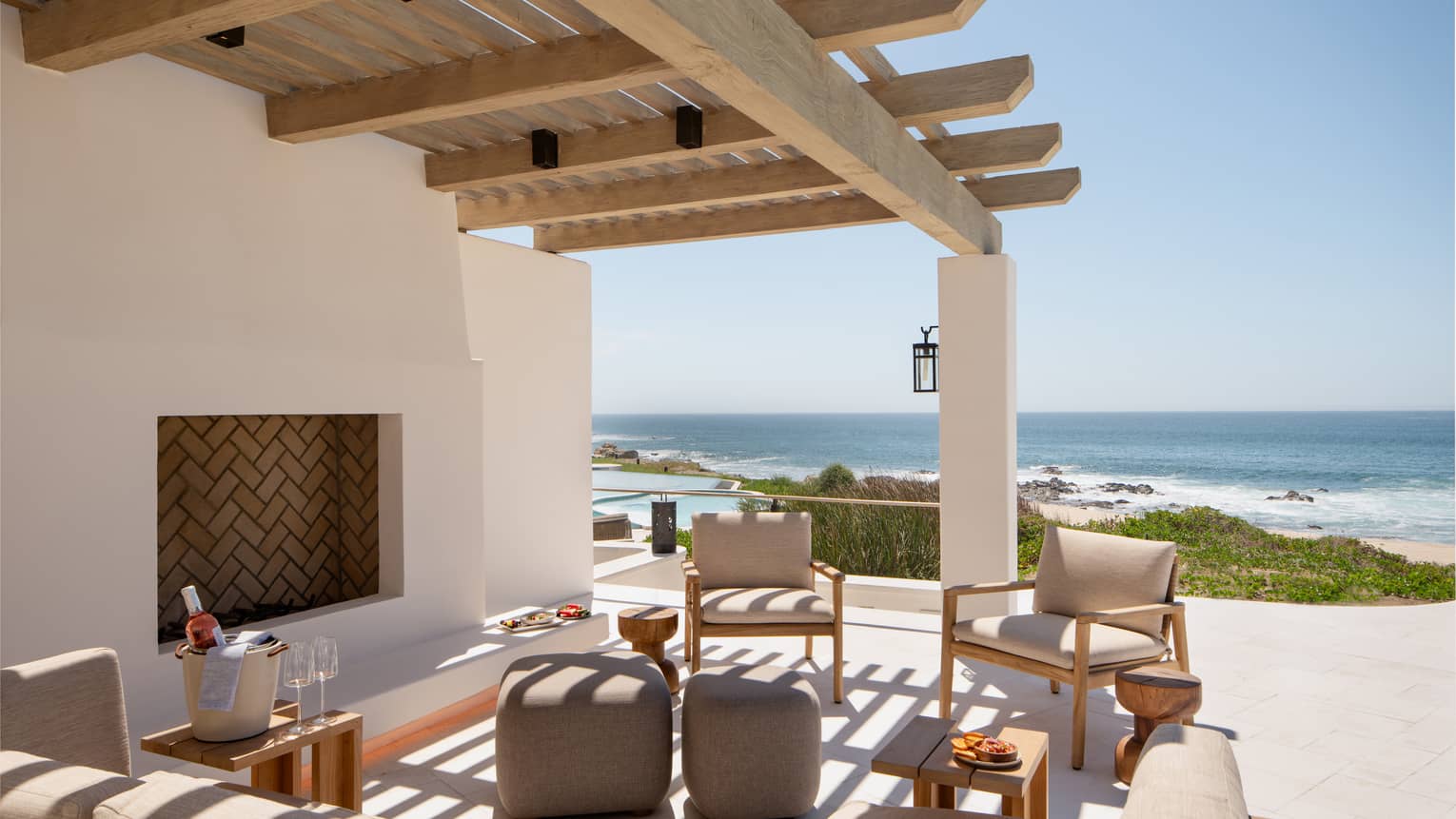 Outdoor lounge and terrace with pergola, overlooking the sea in Cabo