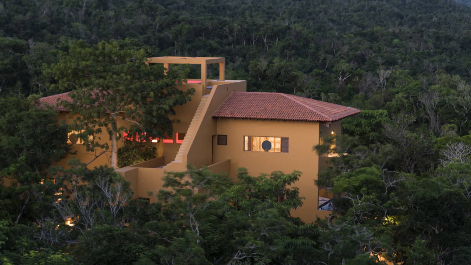 A villa is nestled in the jungle
