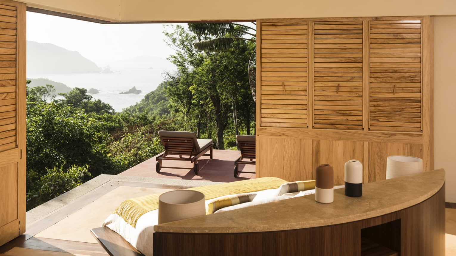 Bedroom opening to a private ocean-view terrace