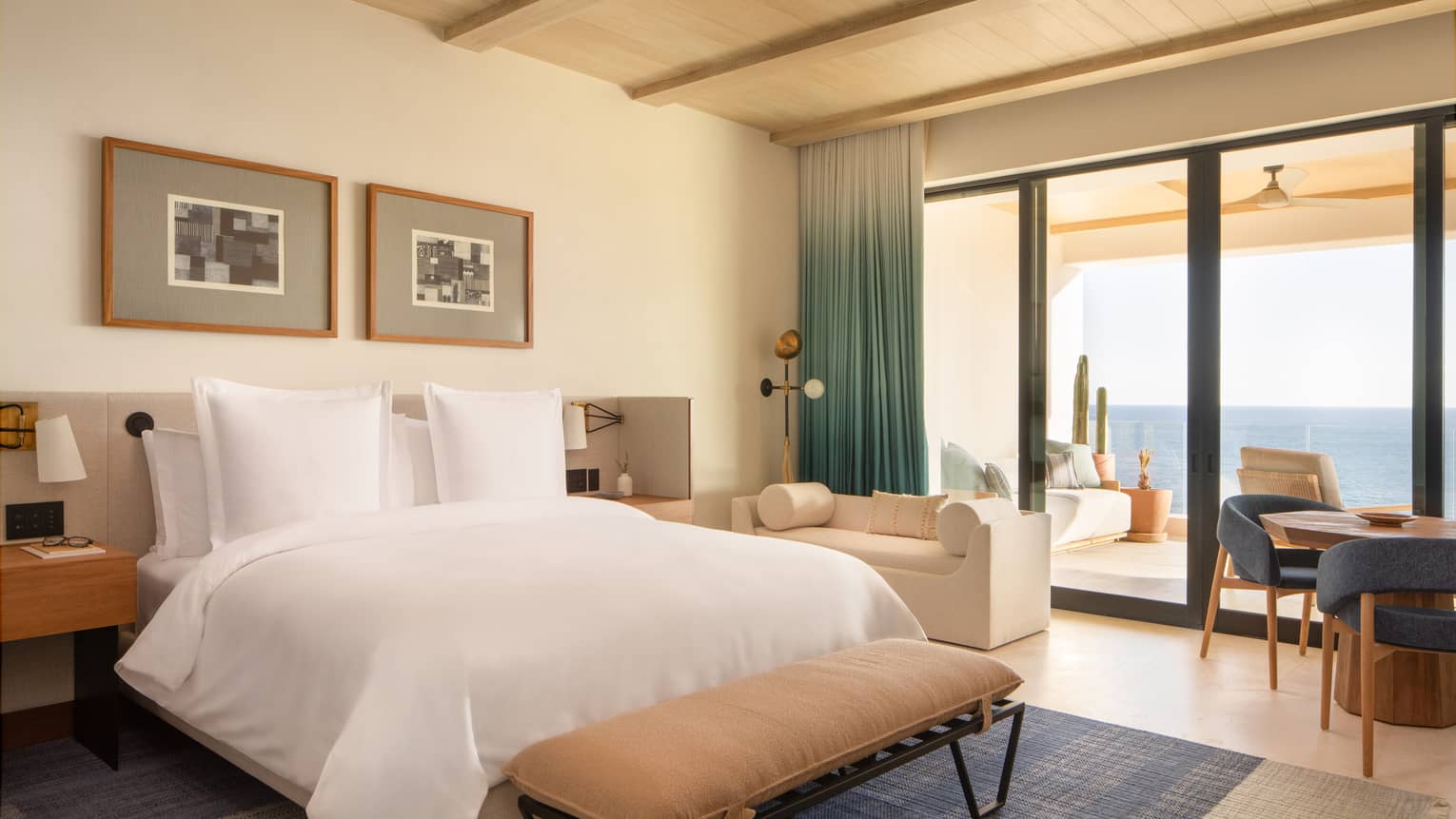 Contemporary bedroom of luxury residence with king bed and walk-out sea-view terrace