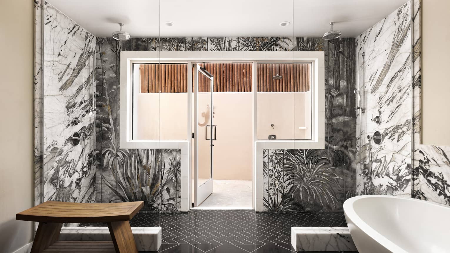 Large bathroom with dual showers, black and white abstract marble tile, a black tile floor, separate tub, and an entrance to private outdoor terrace