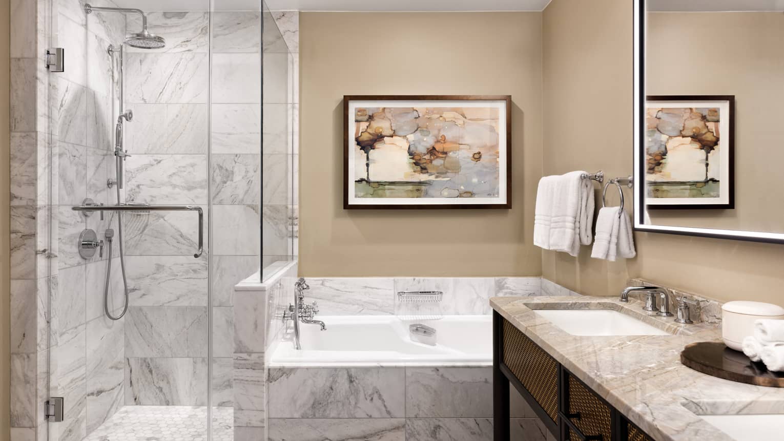 Bathroom with a separate marble shower and tub, adjacent to a double vanity