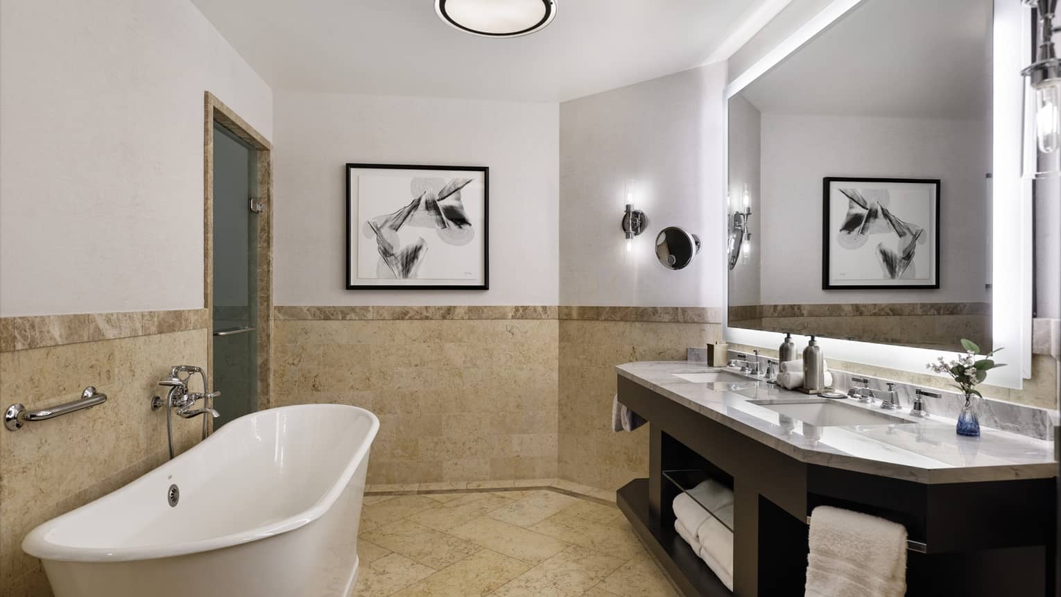 Bathroom with double vanity and standalone tub