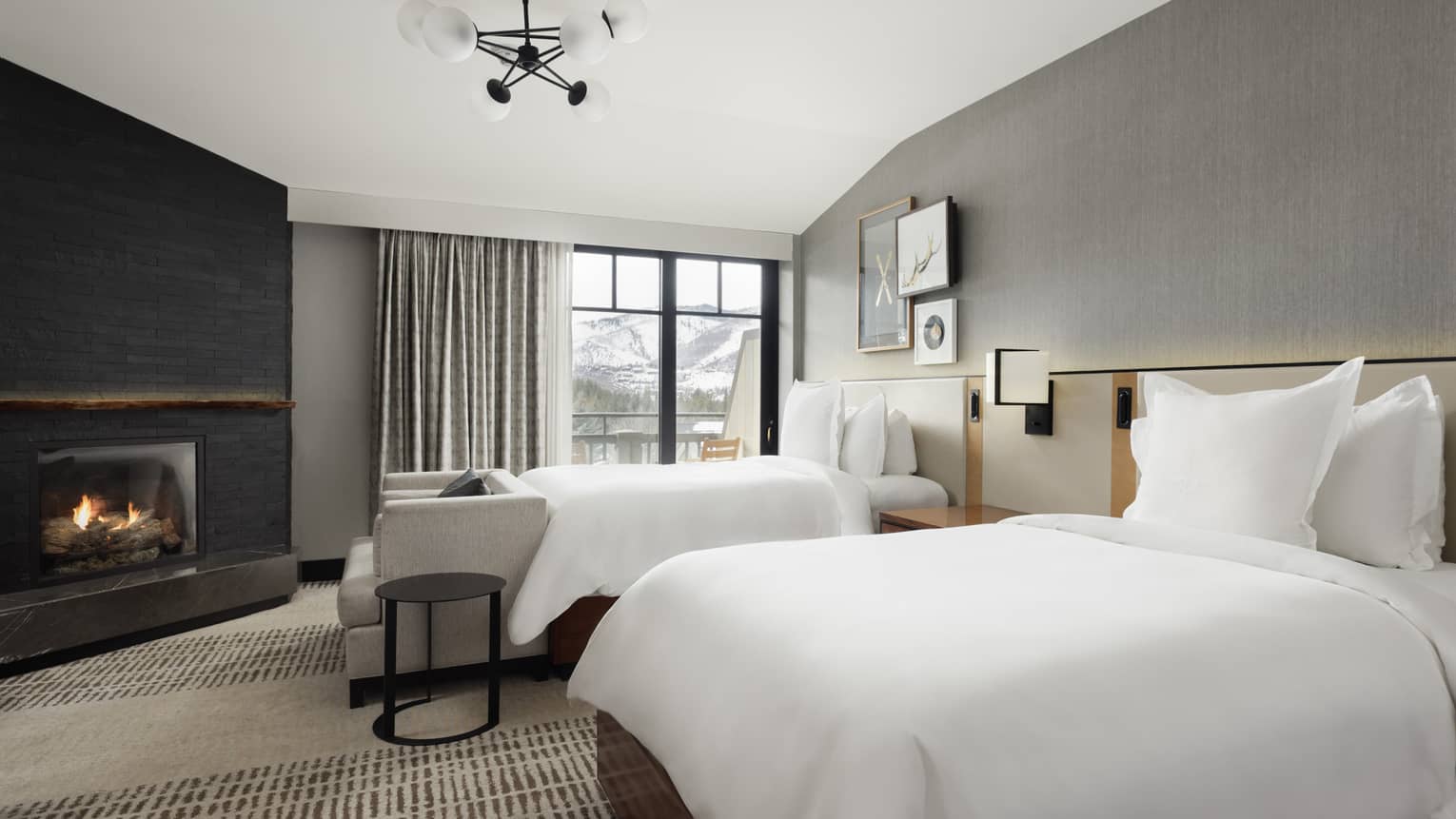 Bedroom with two beds and fireplace