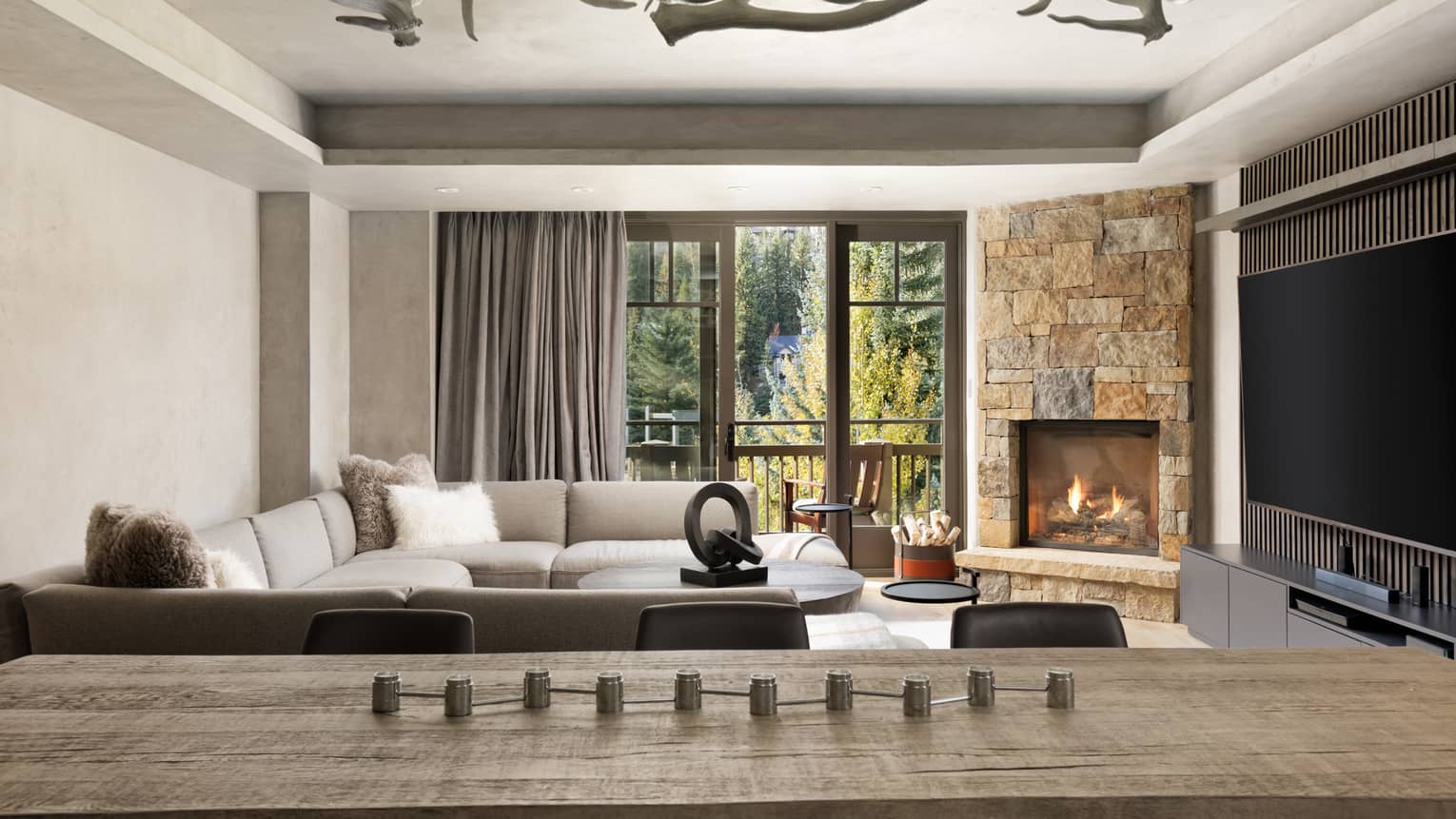 Wooden dining table, six leather chairs, living room with walk-out balcony