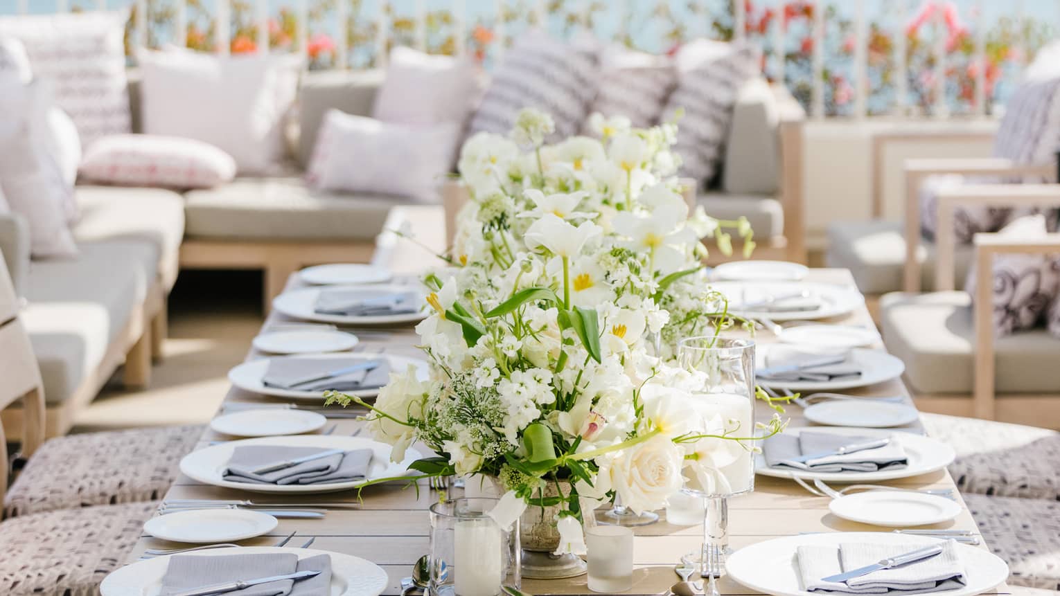 Set dining table on private terrace overlooking ocean