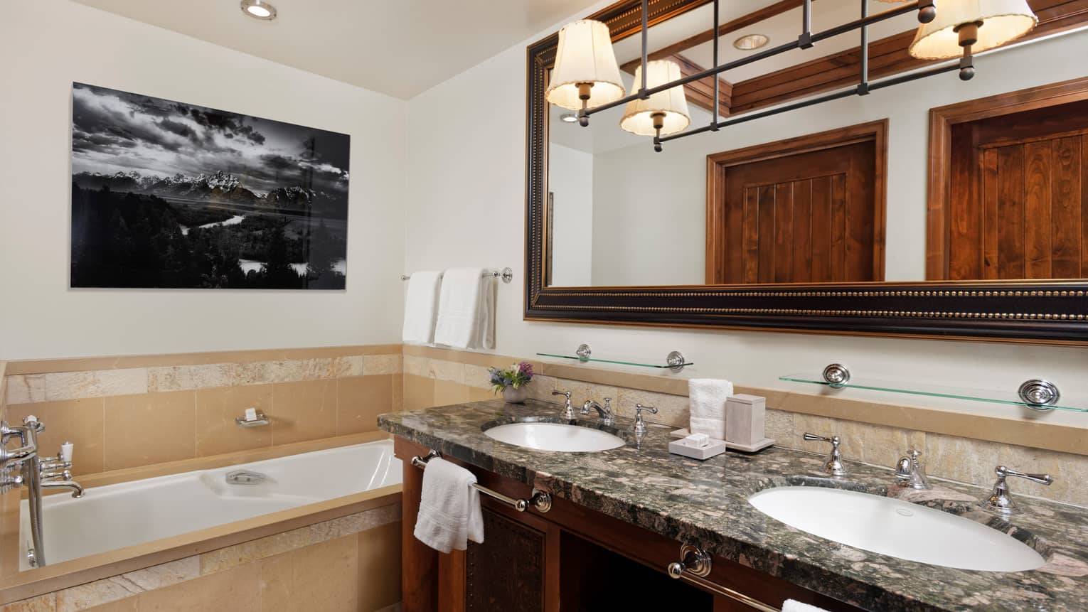 Bathroom with double vanity and tub