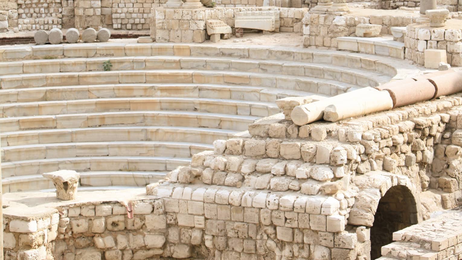 Alexandria’s Roman Amphitheatre, trees and buildings in background