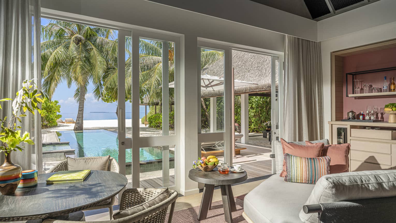 Indoor sitting area and wet bar, leading out to private pool terrace