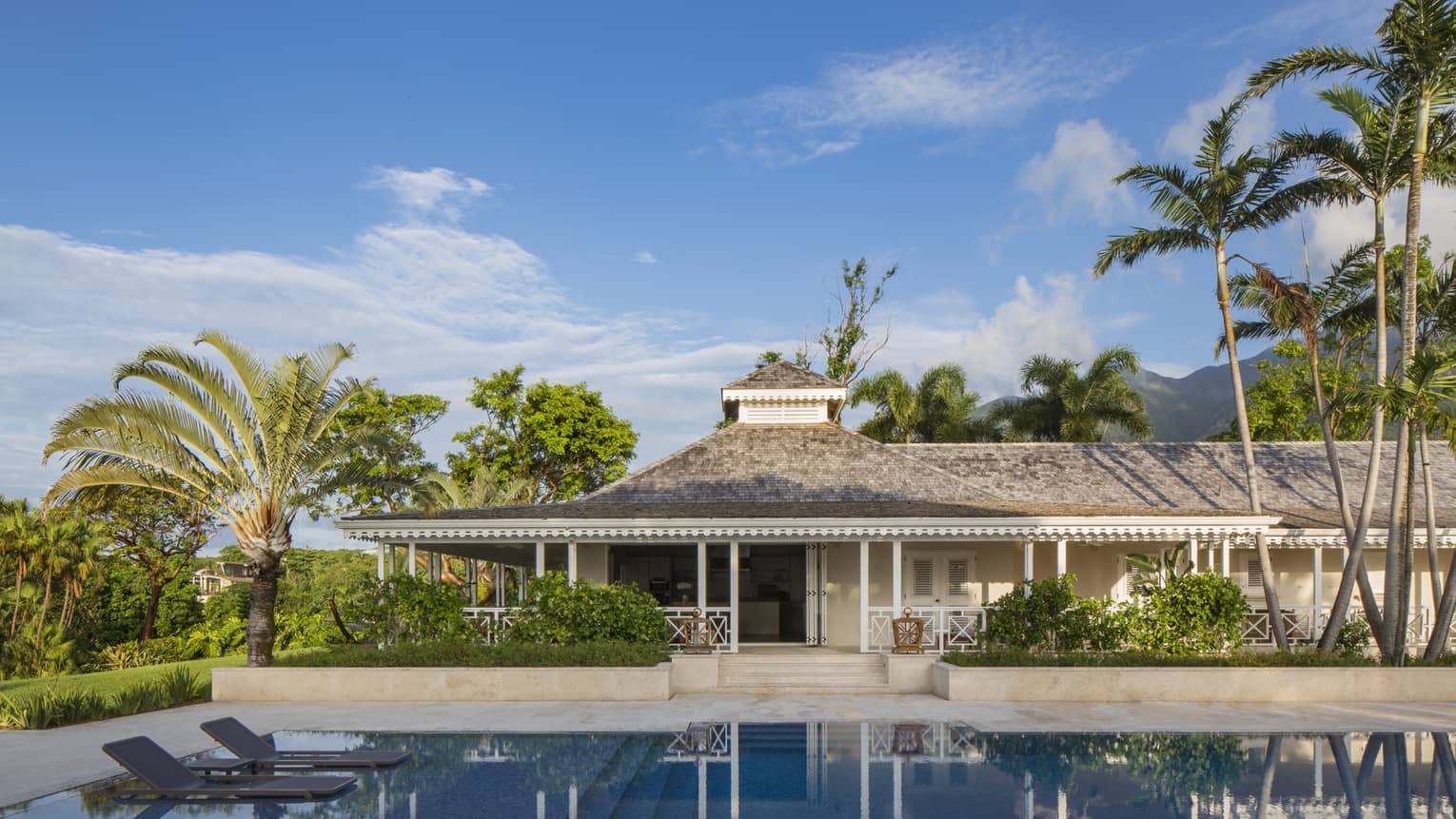 Large, private plunge swimming pool, floating lounge chairs outside Palm Grove Residence Villa