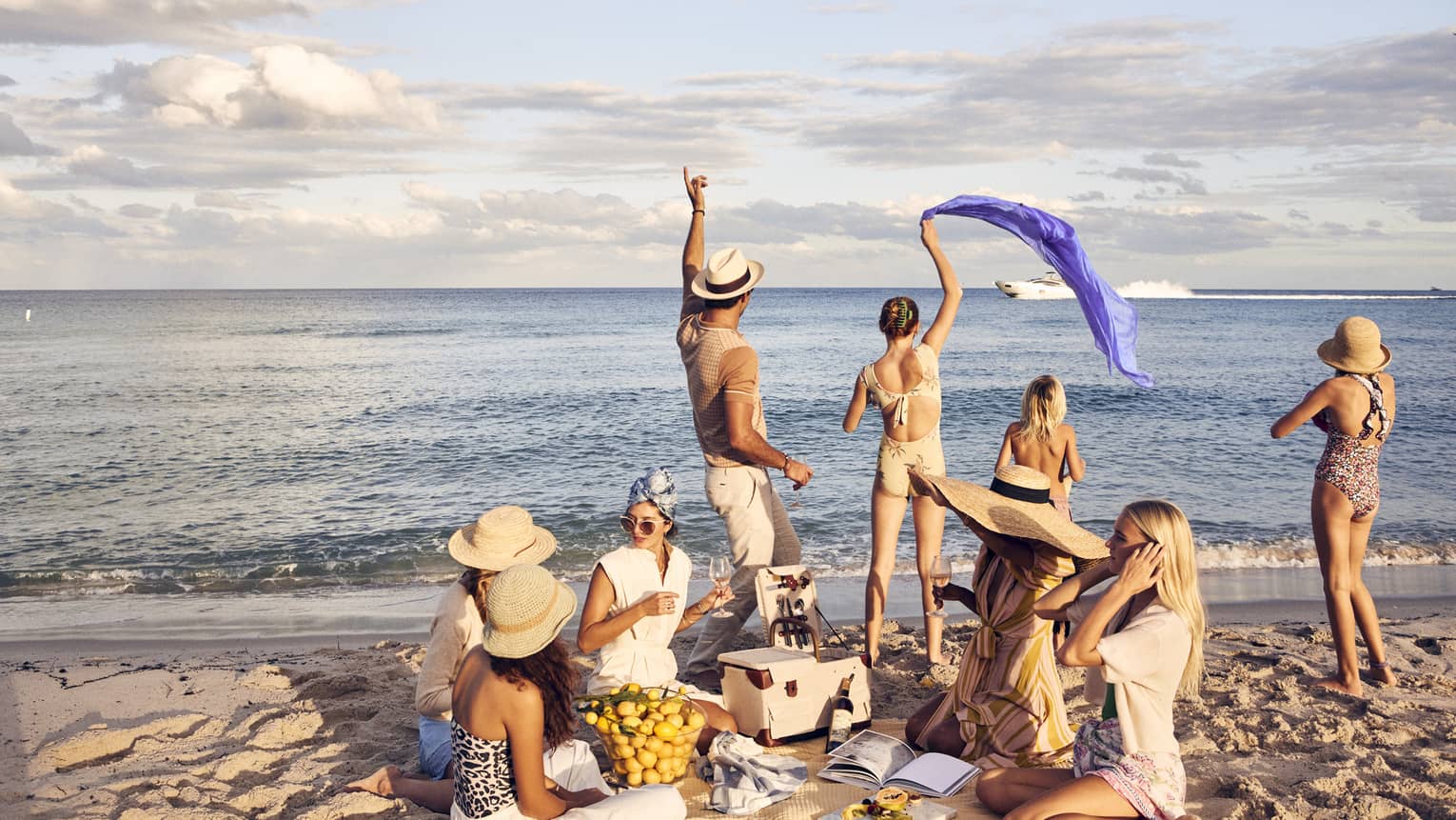 A group of people having a picnic on a beach.