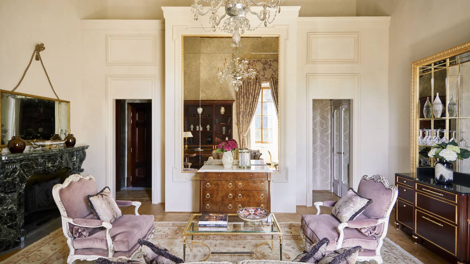 Frescoed Executive Suite living room with two love seats facing each other and chandelier, at Four Seasons Hotel Florence