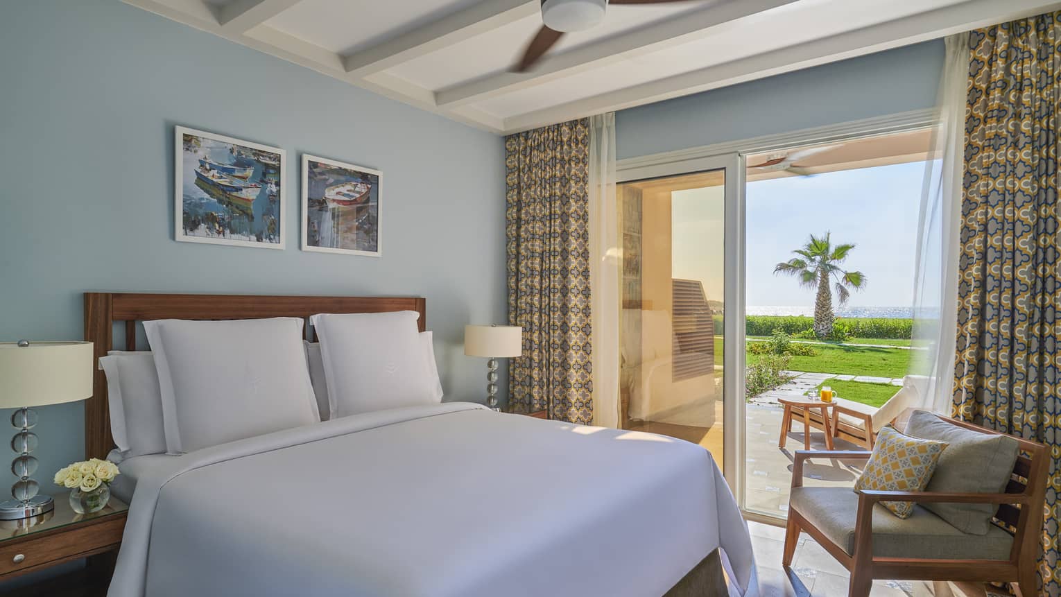 A freshly-made bed in the beach suite overlooking the marsh