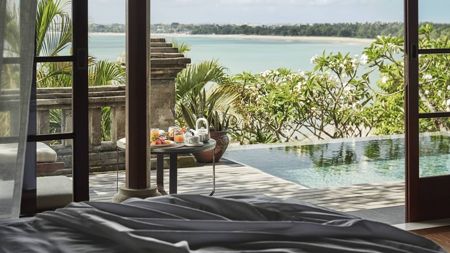 Private pool by villa and view of beach