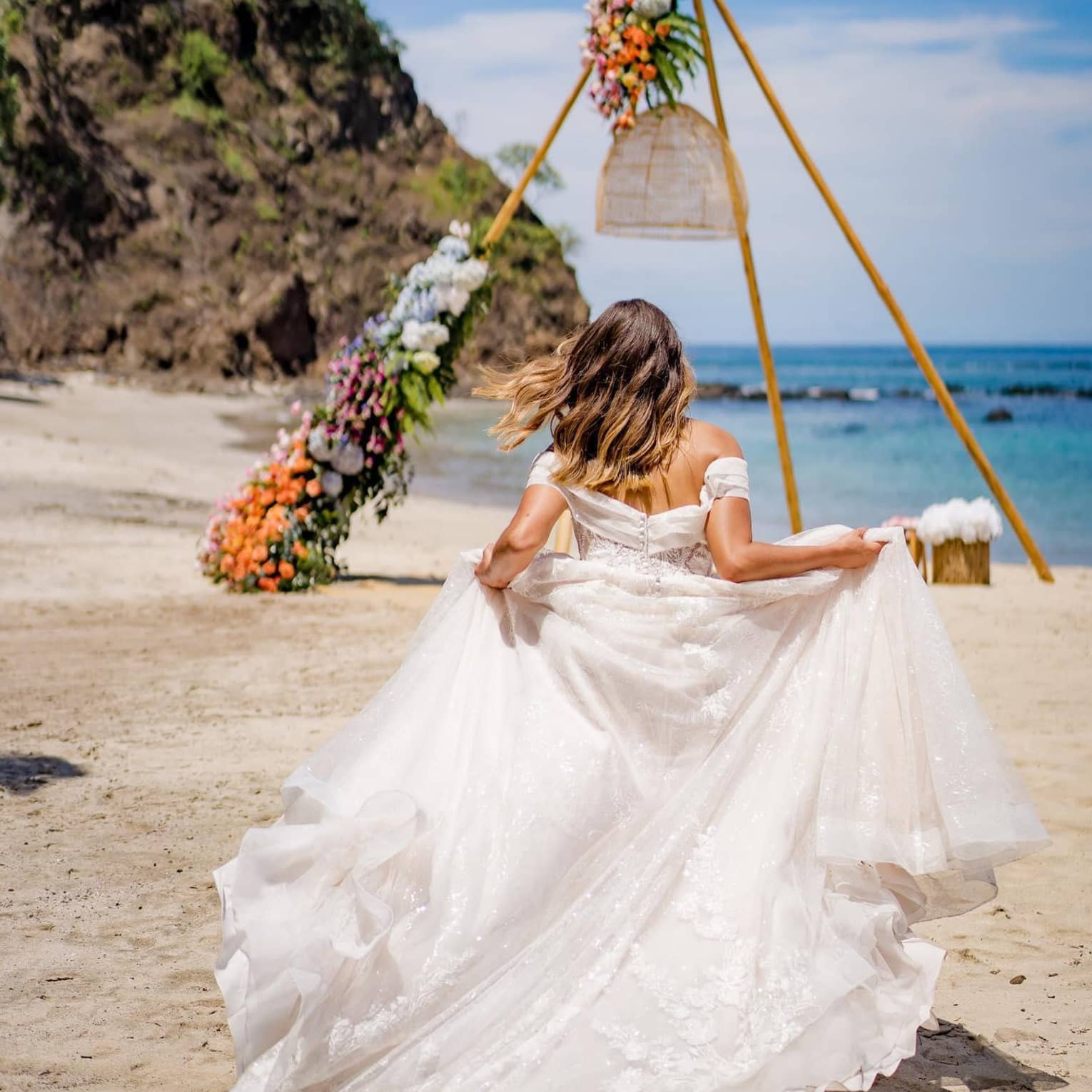 Bride running on the beach